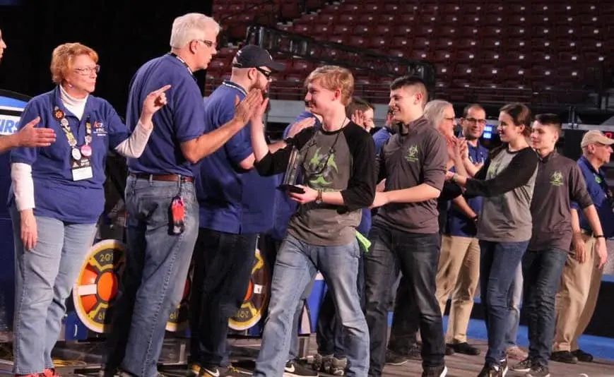 Team members receiving an award at competition